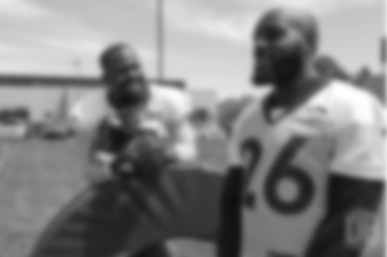 outside linebacker Von Miller (58) talks with safety Darian Stewart (26) on the sideline during the 10th and final day of OTAs on June 7, 2018 at UCHealth Training Center.