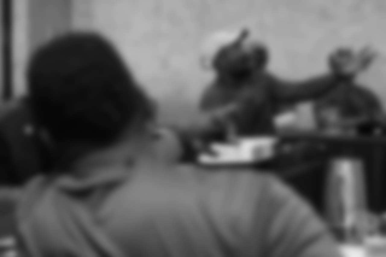 Von Miller reviews player film at Von Miller's Pass Rush Summit, which included hands-on instruction and drills, on June 28, 2018.