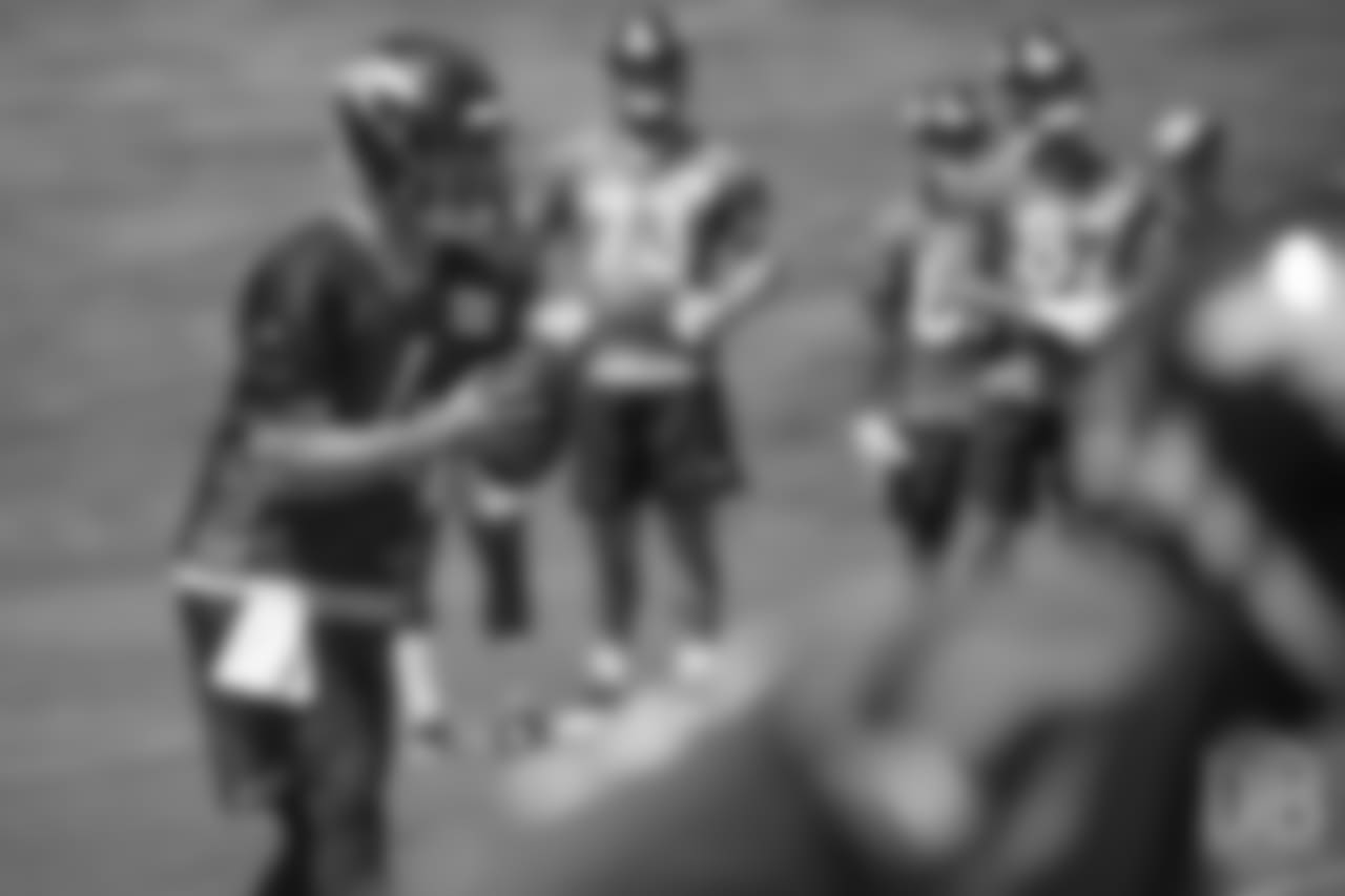 quarterback Case Keenum (4) glances at a receiver after the snap during the 10th and final day of OTAs on June 7, 2018 at UCHealth Training Center.