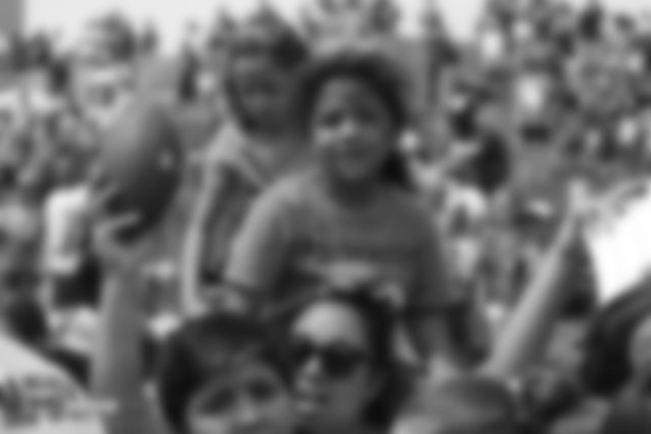 A young girl waits in the crowd hoping for an autograph at the sixth day of training camp on August 3, 2018, at UCHealth Training Center. Friday was Kids Day.