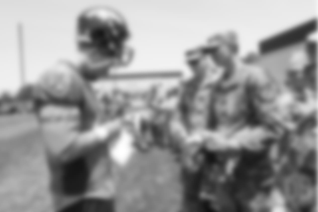 Long snapper Casey Kreiter (42) meets military members of the Colorado Air National Guard and the U.S. Army after practice on June 12, 2018. The meet-and-greet was part of an event hosting servicemen and servicewomen with USAA and the Broncos Womens Organization.