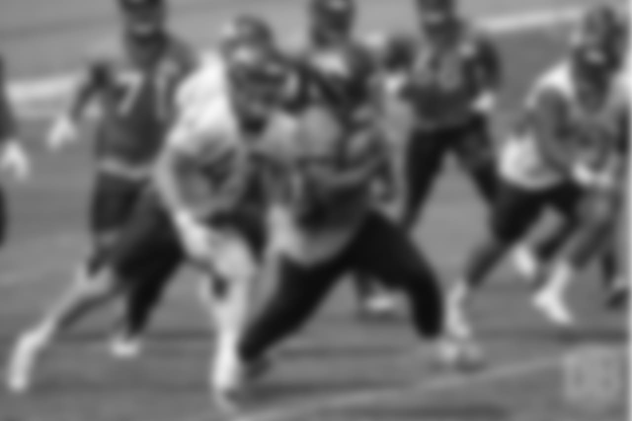 running back De'Angelo Henderson Sr. (33) breaks loose on a run during the 10th and final day of OTAs on June 7, 2018 at UCHealth Training Center.