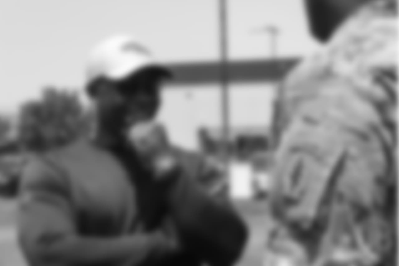 Head Coach Vance Joseph meets military members of the Colorado Air National Guard and the U.S. Army after practice on June 12, 2018. The meet-and-greet was part of an event hosting servicemen and servicewomen with USAA and the Broncos Womens Organization.