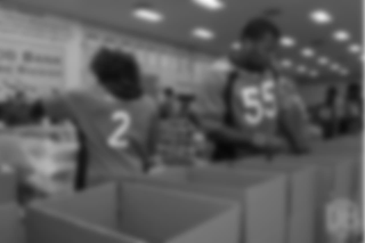 Outside linebacker Bradley Chubb (55) packs food at the Food Bank of the Rockies at the Broncos' third annual Rookie Community Service Day on June 11, 2018.