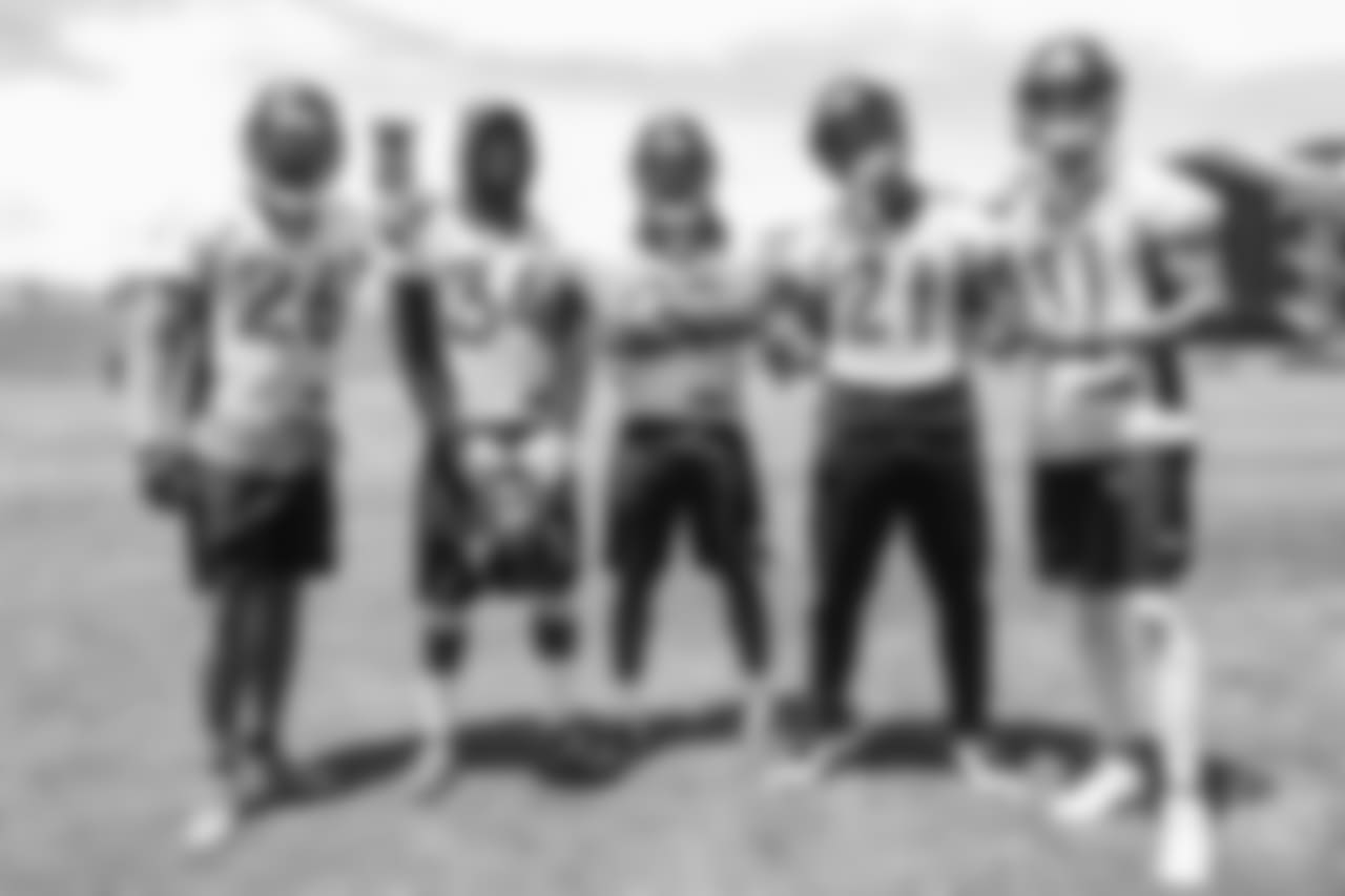 safety Darian Stewart (26), safety Will Parks (34), cornerback Bradley Roby (29), safety Su'a Cravens (21) and safety Justin Simmons (31) pose for a photo after the ninth day of OTAs on June 6, 2018 at UCHealth Training Center.