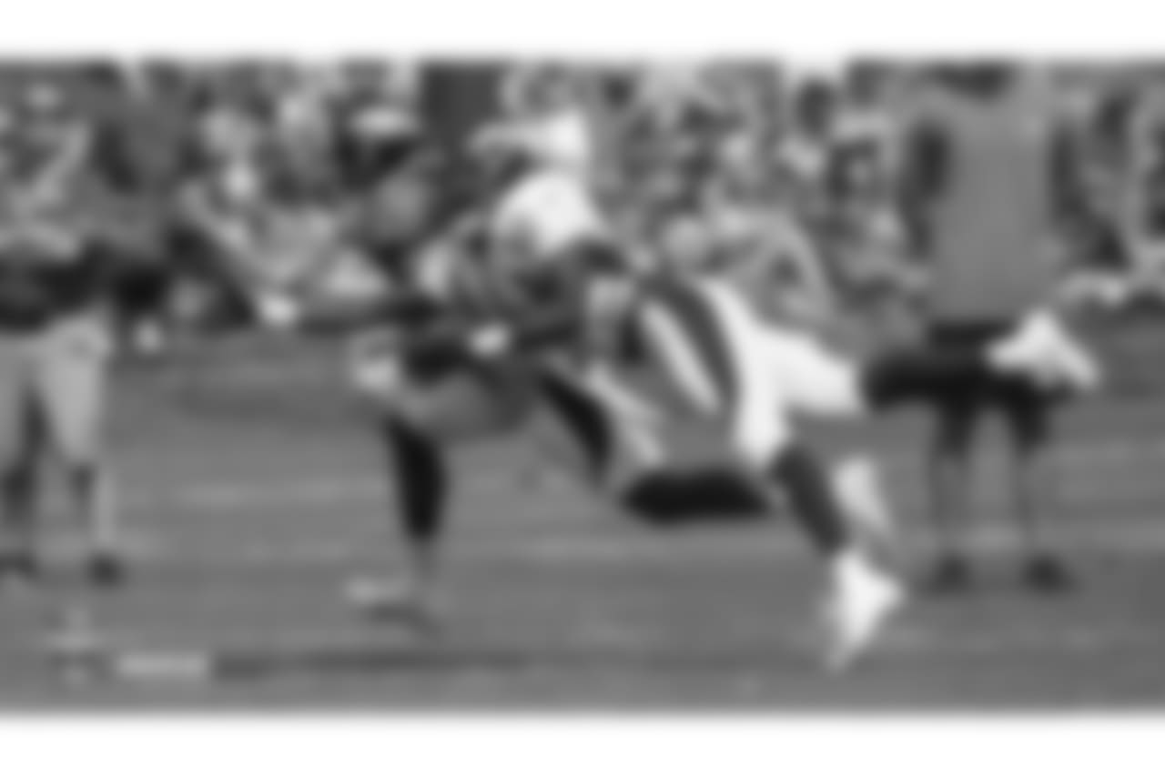 Cornerback Isaac Yiadom (41) reaches to deflect a pass during the ninth day of training camp on August 7, 2018, at UCHealth Training Center.