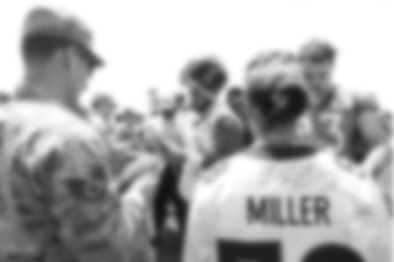 Nose tackle Kyle Peko (90) and tight end Matt LaCosse (83) meet military members of the Colorado Air National Guard and the U.S. Army after practice on June 12, 2018. The meet-and-greet was part of an event hosting servicemen and servicewomen with USAA and the Broncos Womens Organization.