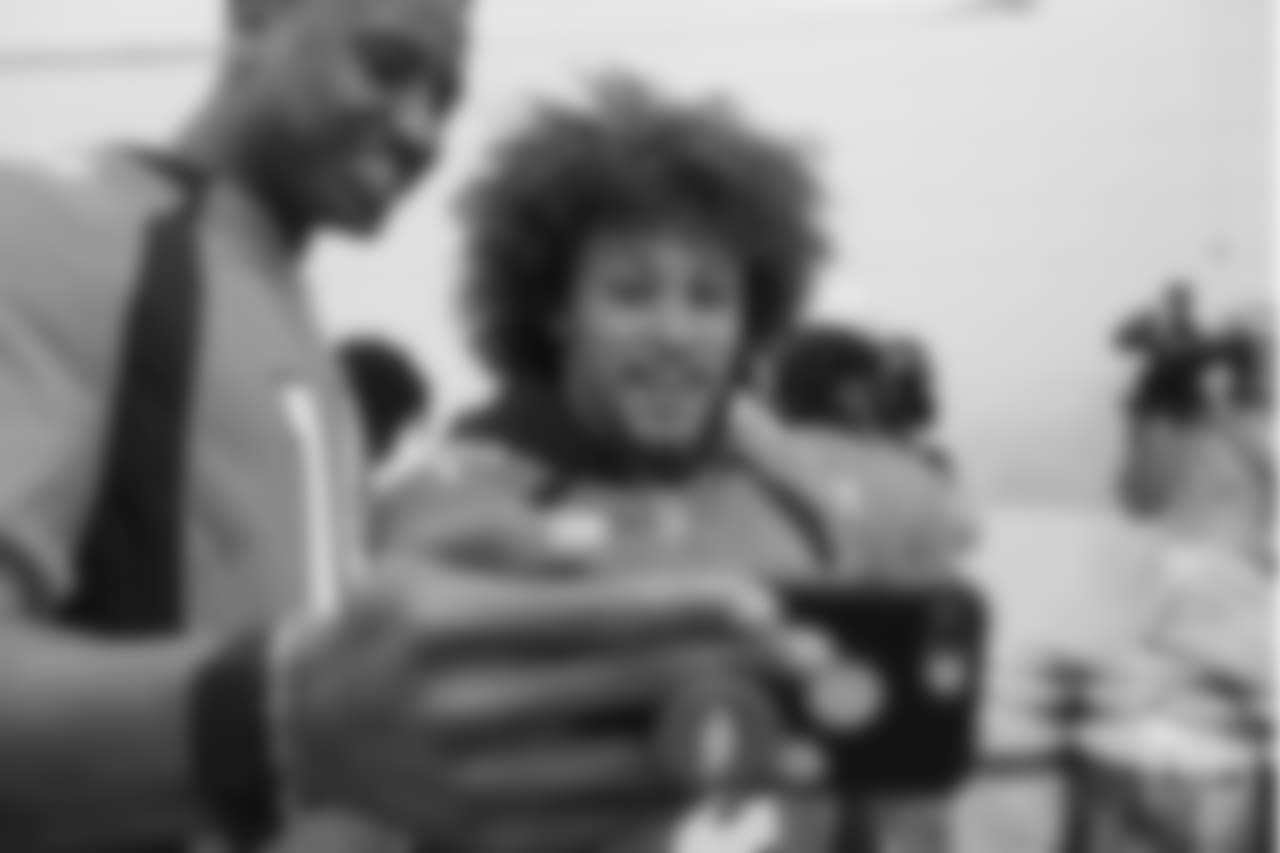 Wide receiver Courtland Sutton (14) and running back Phillip Lindsay (2) take a selfie at the Food Bank of the Rockies at the Broncos' third annual Rookie Community Service Day on June 11, 2018.