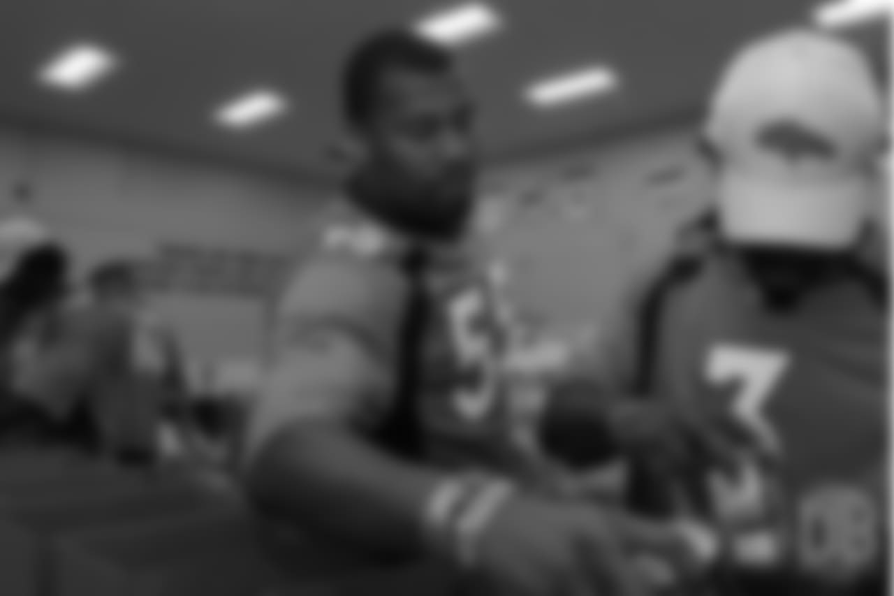 Outside linebacker Bradley Chubb (55) helps pack food with defensive back Trey Marshall (3) at the Food Bank of the Rockies at the Broncos' third annual Rookie Community Service Day on June 11, 2018.