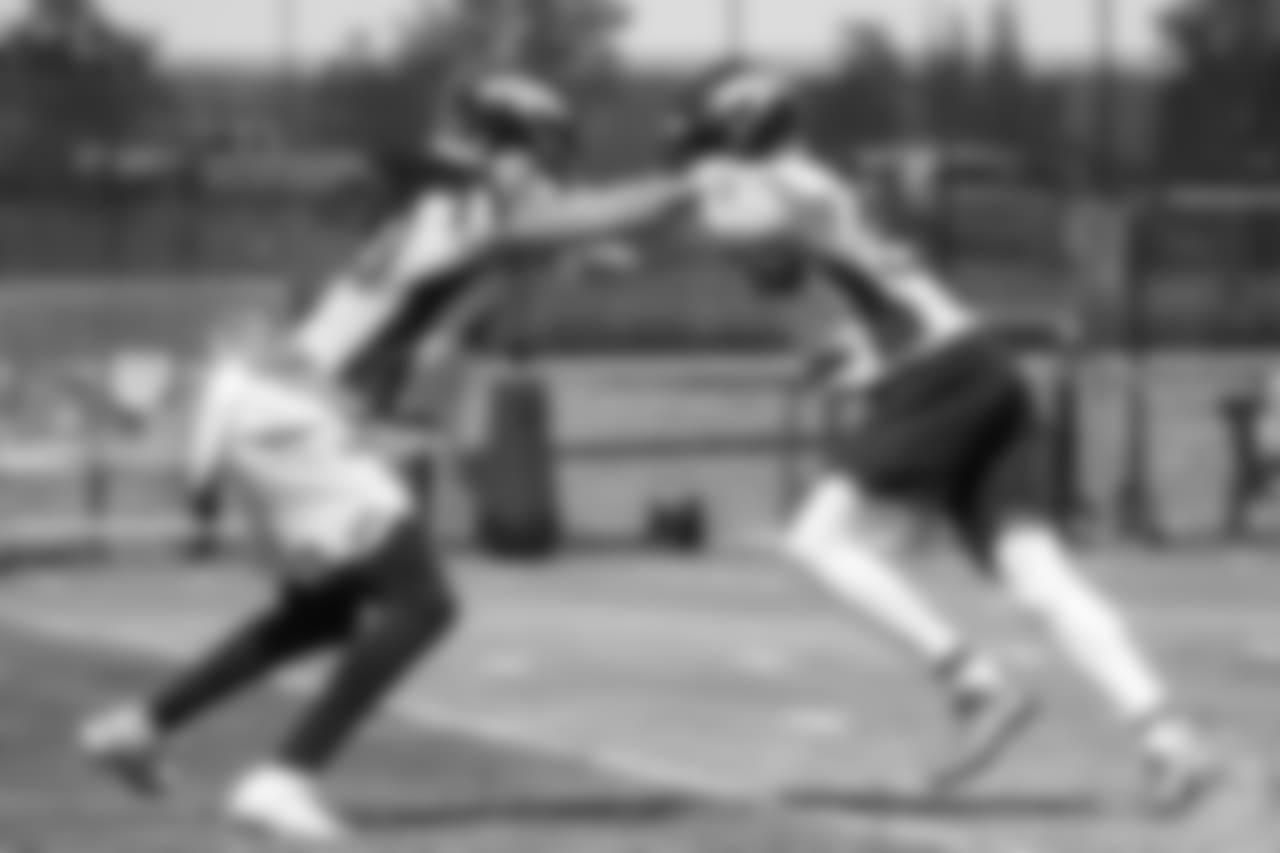 safety Jamal Carter (20) grapples wiith safety Dymonte Thomas (35) during drills at the ninth day of OTAs on June 6, 2018 at UCHealth Training Center.
