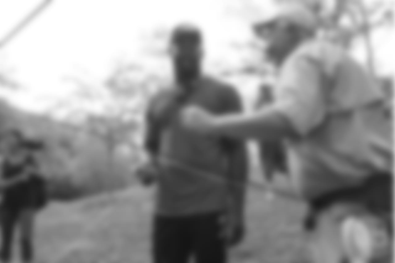 Von Miller gets a fly fishing lesson at the fishing portion of Von Miller's Pass Rush Summit at Dogwood Canyon Nature Park on June 28, 2018.