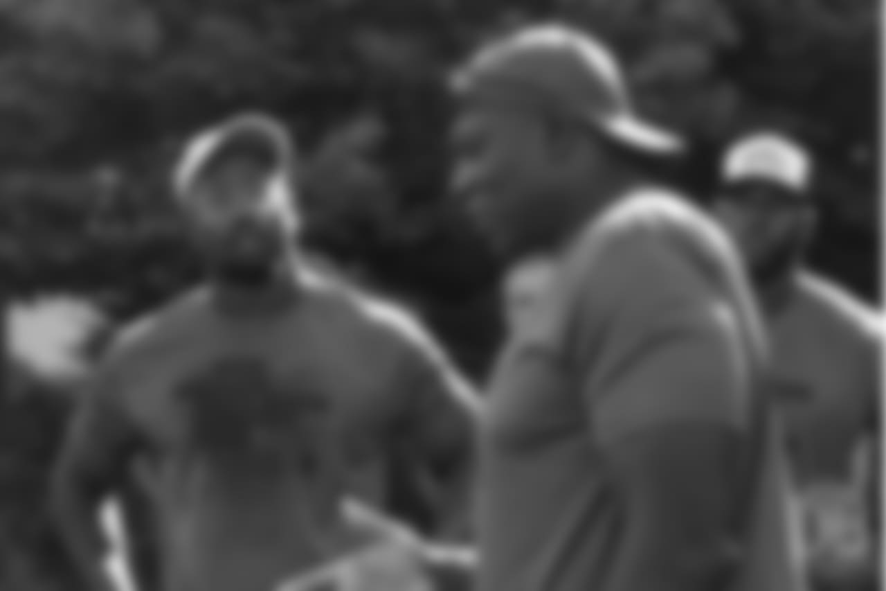Von Miller listens as Bruce Smith gives instruction during the on-field portion of Von Miller's Pass Rush Summit, which included hands-on instruction and drills, on June 28, 2018.