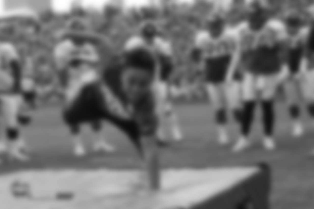 Nose tackle Domata Peko Sr. (94)'s son Joseph dives during a defensive line drill at the sixth day of training camp on August 3, 2018, at UCHealth Training Center.