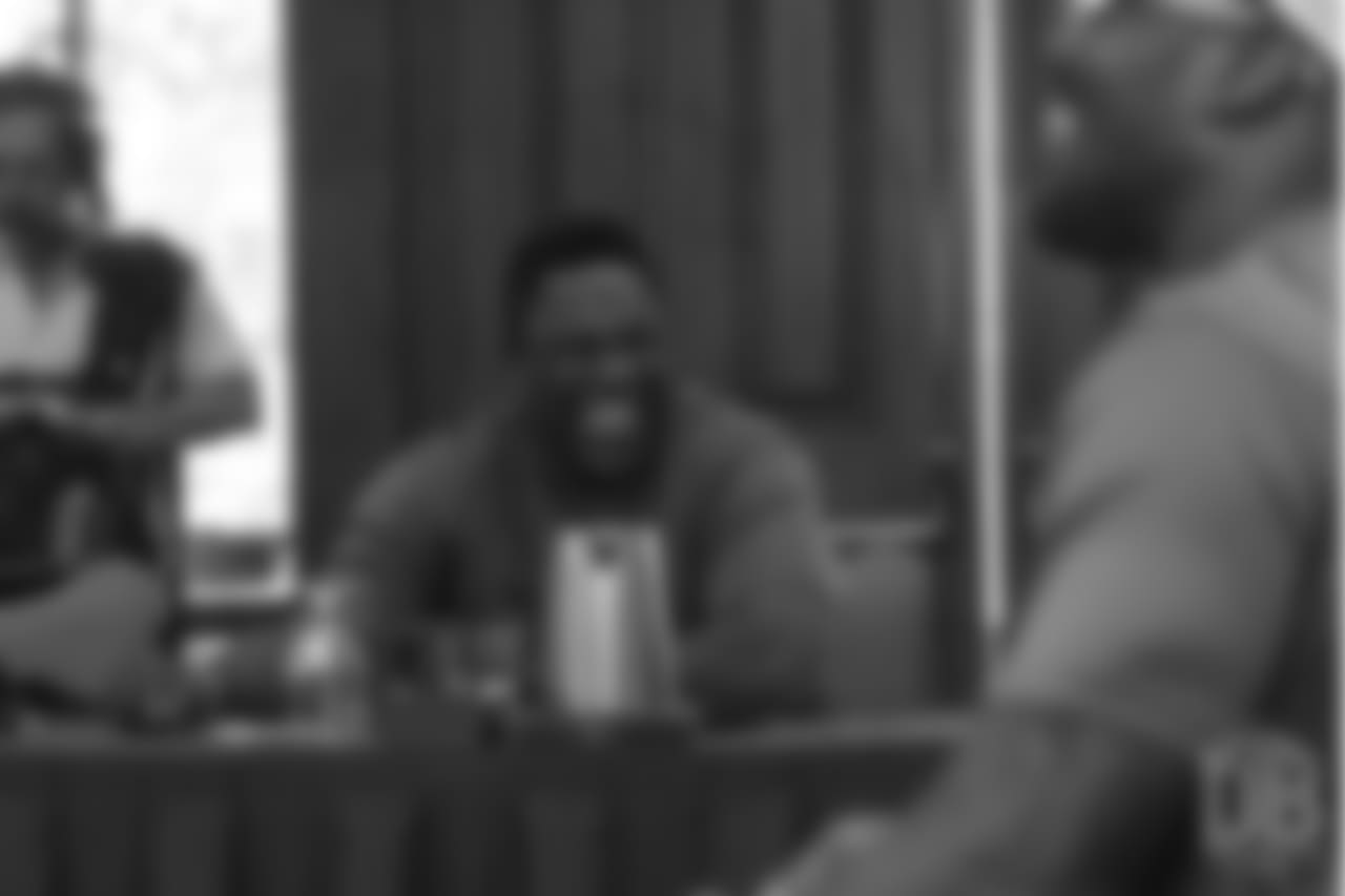 Warren Sapp laughs as he reviews player film at Von Miller's Pass Rush Summit, which included hands-on instruction and drills, on June 28, 2018.