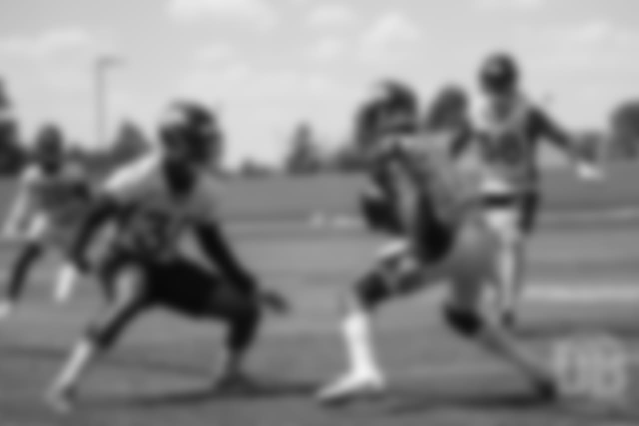 wide receiver Isaiah McKenzie (16) tries to elude safety Jordan Moore (30) during practice at the eighth day of OTAs on June 5, 2018.