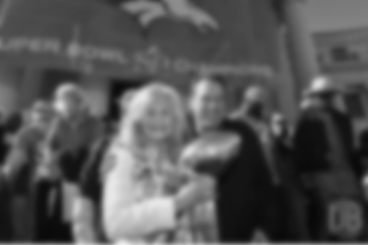 Annabel Bowlen and head coach Gary Kubiak pose for a photo with the Lombardi Trophy during the Broncos' Super Bowl 50 parade and celebration.