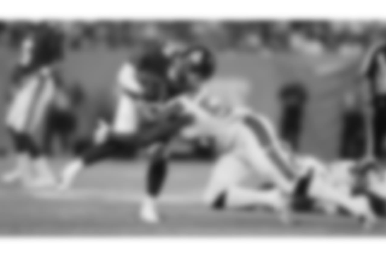 Cleveland Browns linebacker James Burgess (52) tackles New York Giants' Jalen Simmons (34) during the first half of a preseason NFL football game Thursday, Aug. 9, 2018, in East Rutherford, N.J. (AP Photo/Adam Hunger)