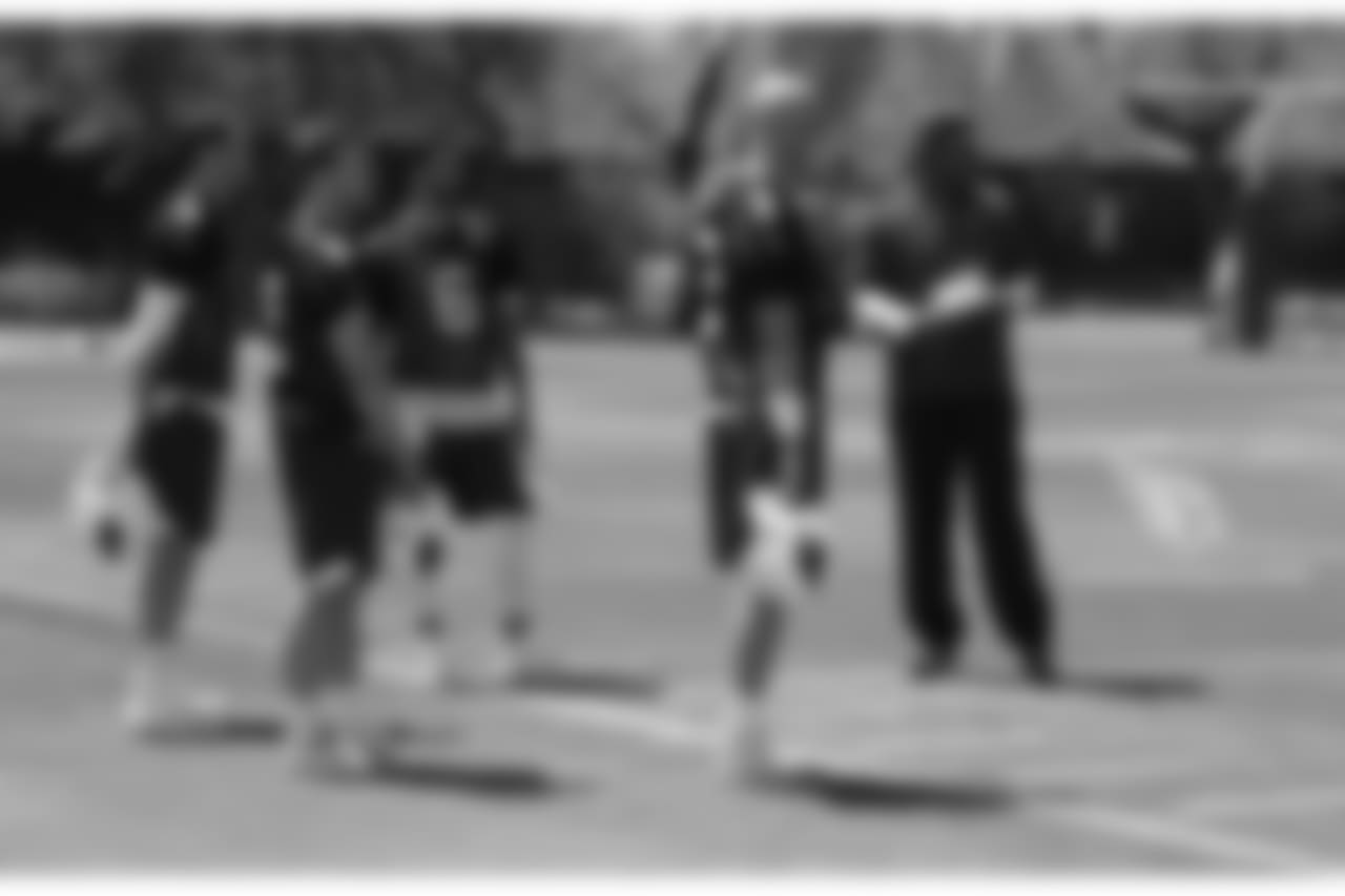 The quarterbacks with coach Byron Leftwich