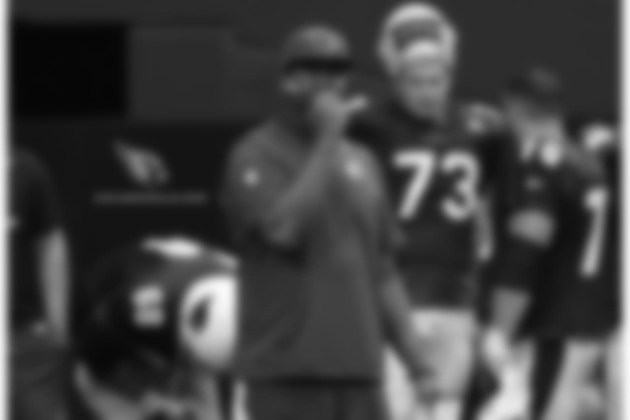 QB coach Byron Leftwich calls in a play