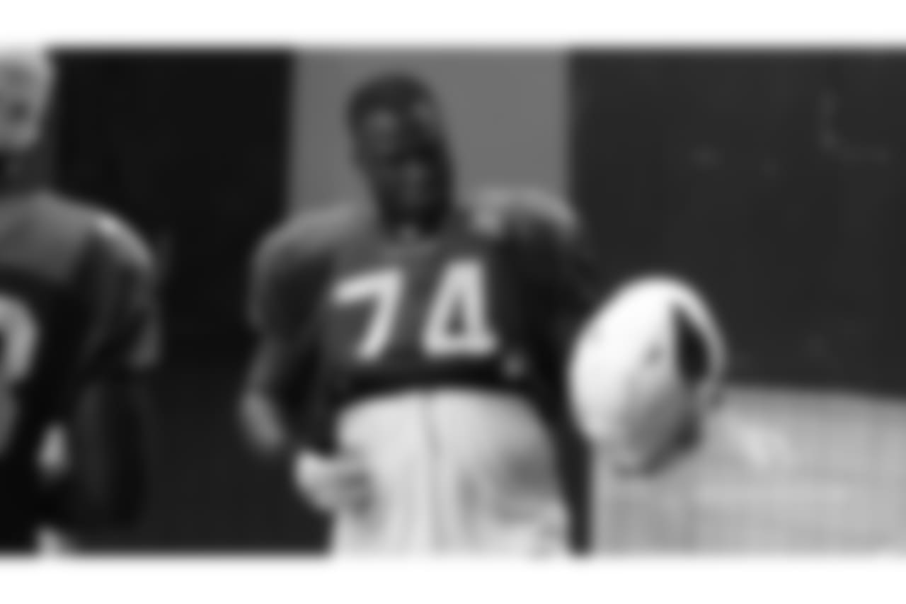 T D.J. Humphries plays air guitar to the music.