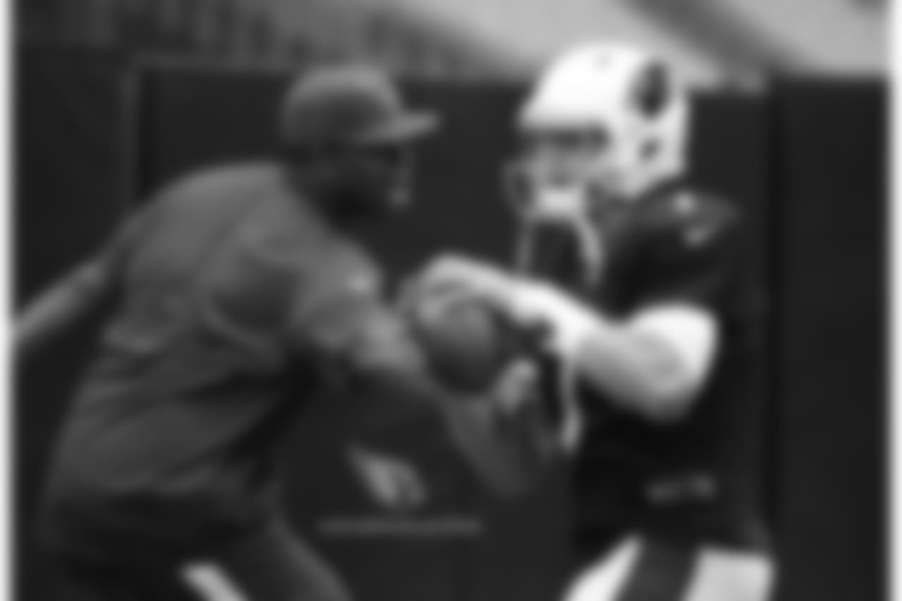 QB Blaine Gabbert tries to avoid QB coach Byron Leftwich in a drill