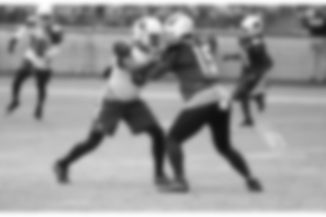S Budda Baker and WR Jeremy Ross lock up