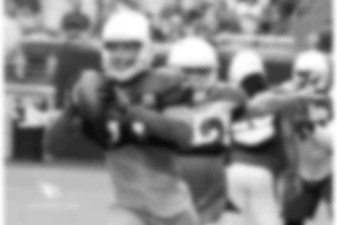 Wide receiver Larry Fitzgerald catches a pass in front of S Tyrann Mathieu