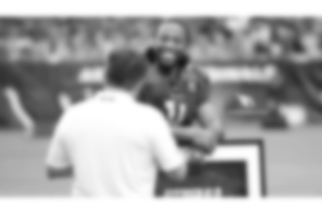 Team president Michael Bidwill congratulates WR Larry Fitzgerald on another Pro Bowl