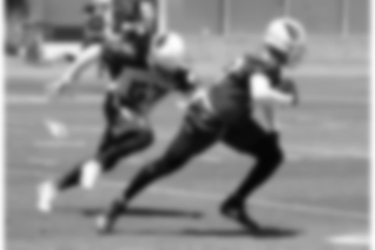 RB D.J. Foster (right) runs away from LB Josh Bynes