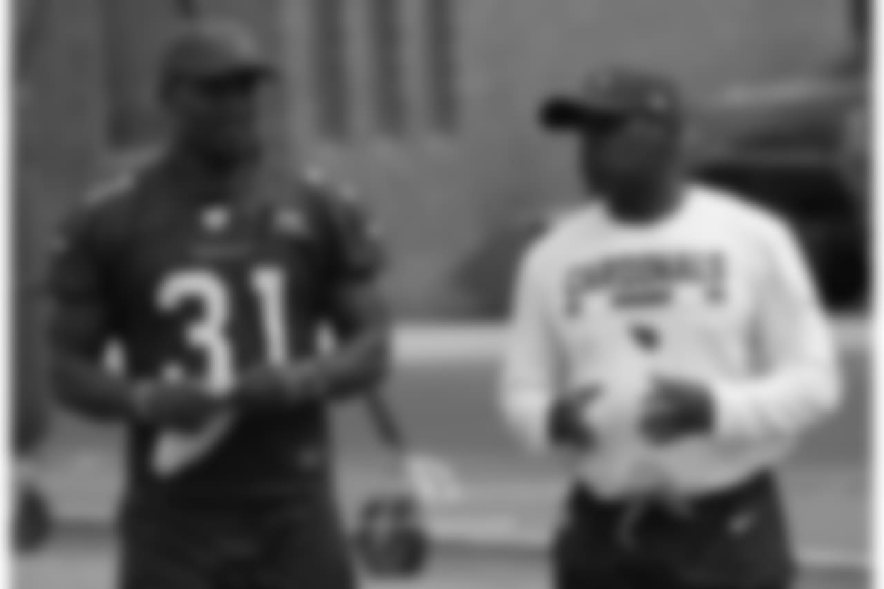 David Johnson chats wth RB coach Kirby Wilson