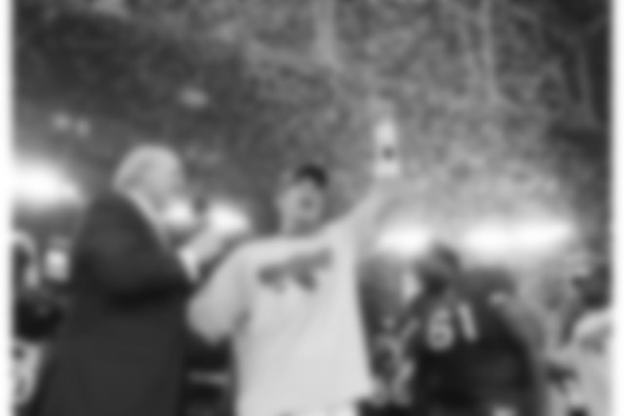 Warner during the on-field celebration of the NFC title