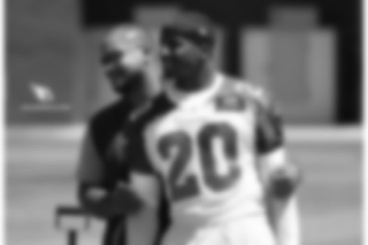 Defensive coordinator Al Holcomb (left) and LB Deone Bucannon