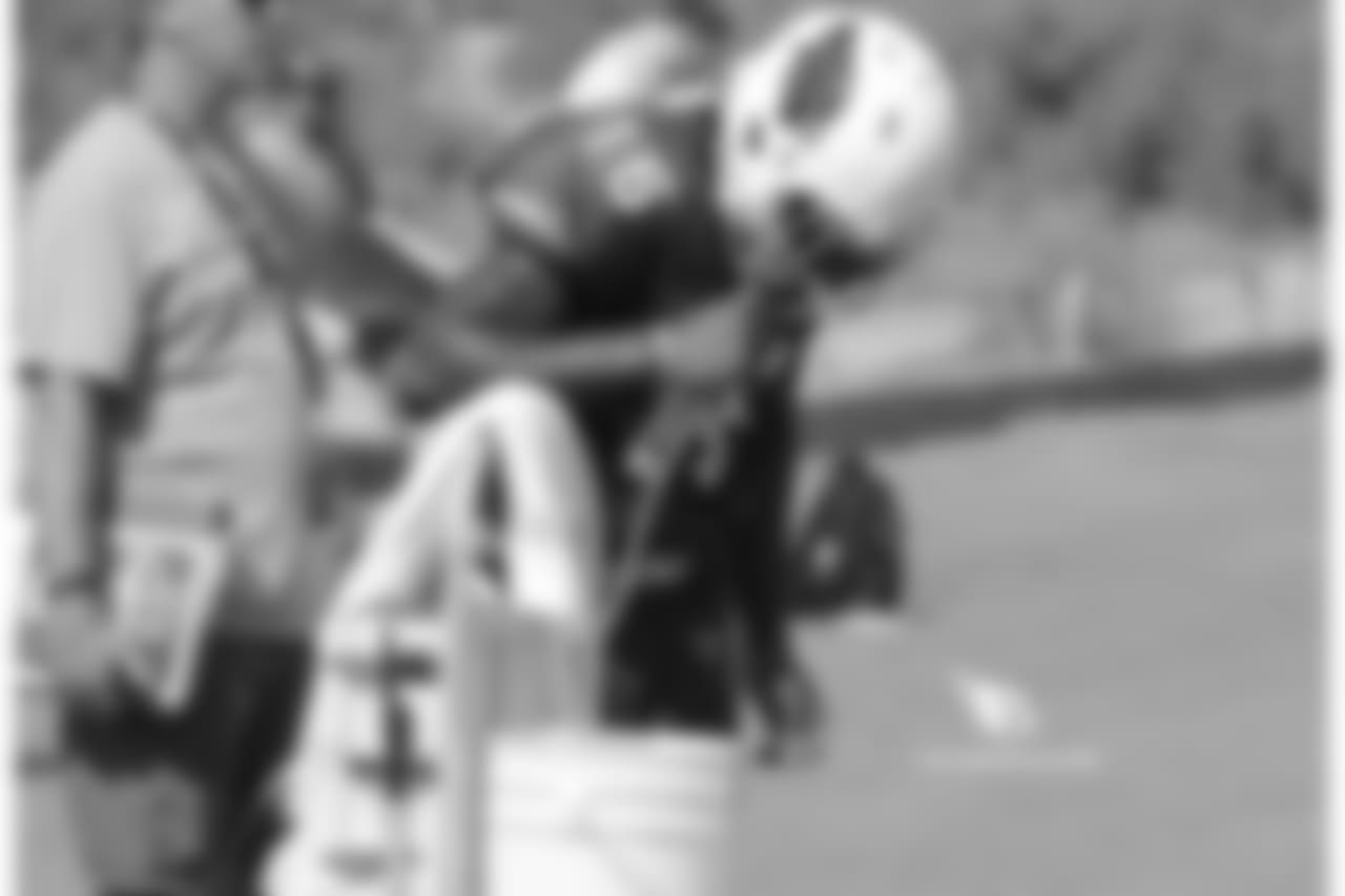 Day 9: WR Chad Williams hydrates during a break in the action