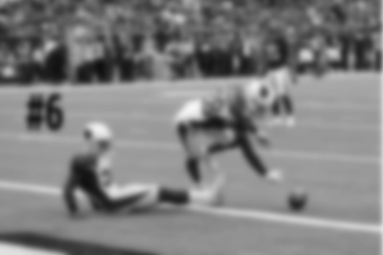 S Budda Baker (left) and CB Justin Bethel pin the Texans at the 1