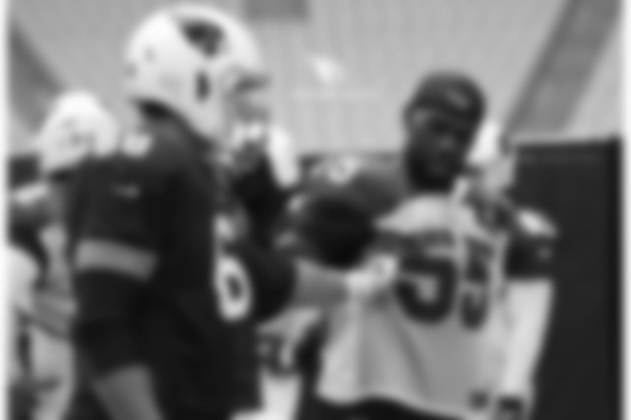 T Jared Veldheer (left) and LB Chandler Jones discuss pass-blocking