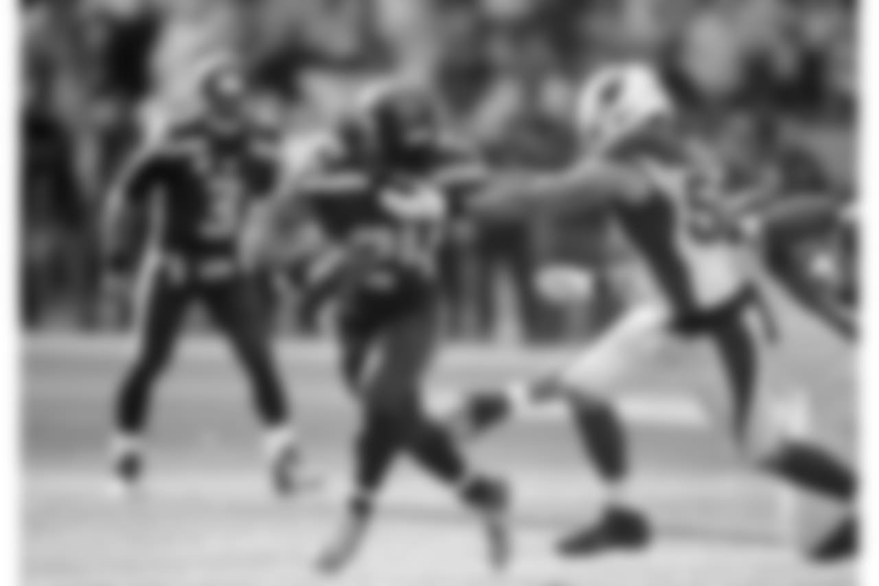 2014: Seahawks RB Marshawn Lynch tries to get away from LB Larry Foote