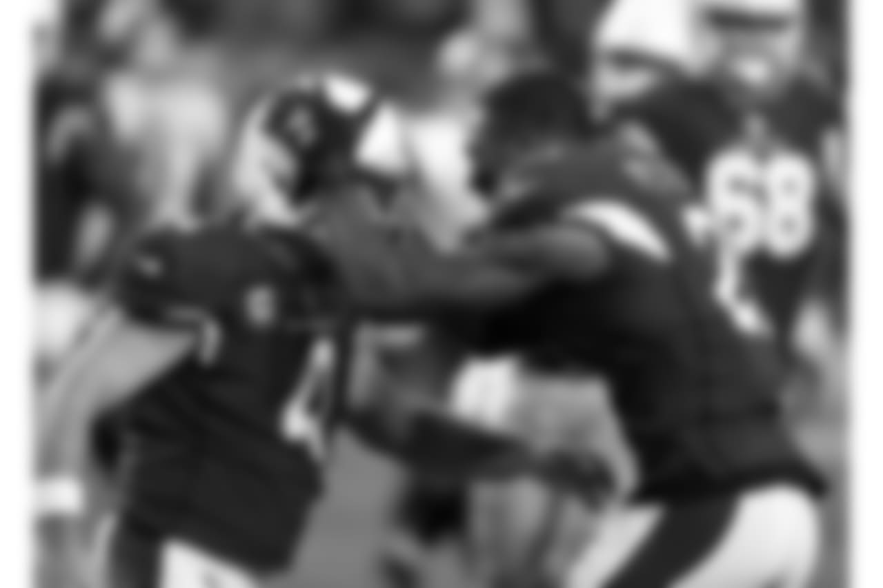 Patrick Peterson (right) reacts to Phil Dawson (right) making the game-winning field goal
