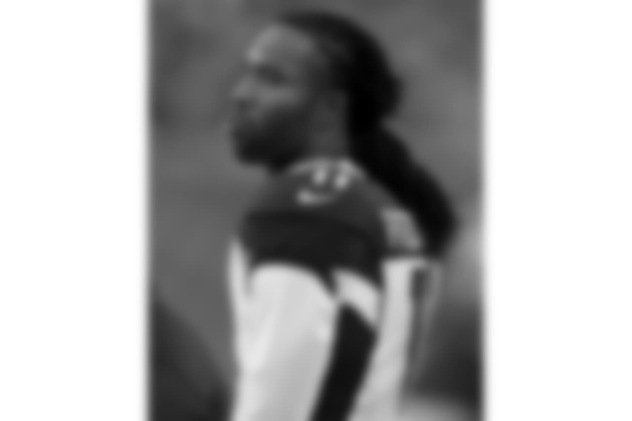 Larry Fitzgerald takes in the game action from the sideline