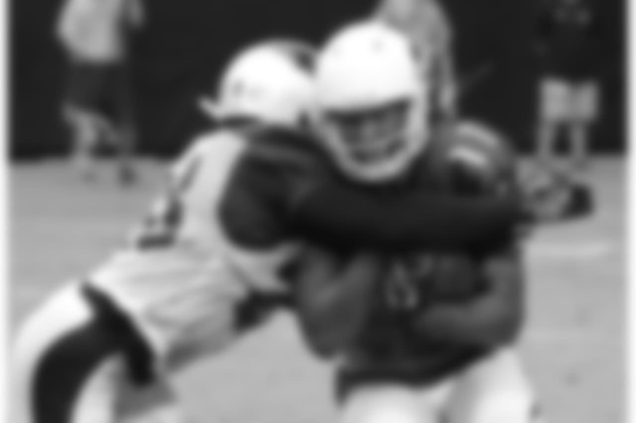 Day 3: WR Larry Fitzgerald takes a hit during practice