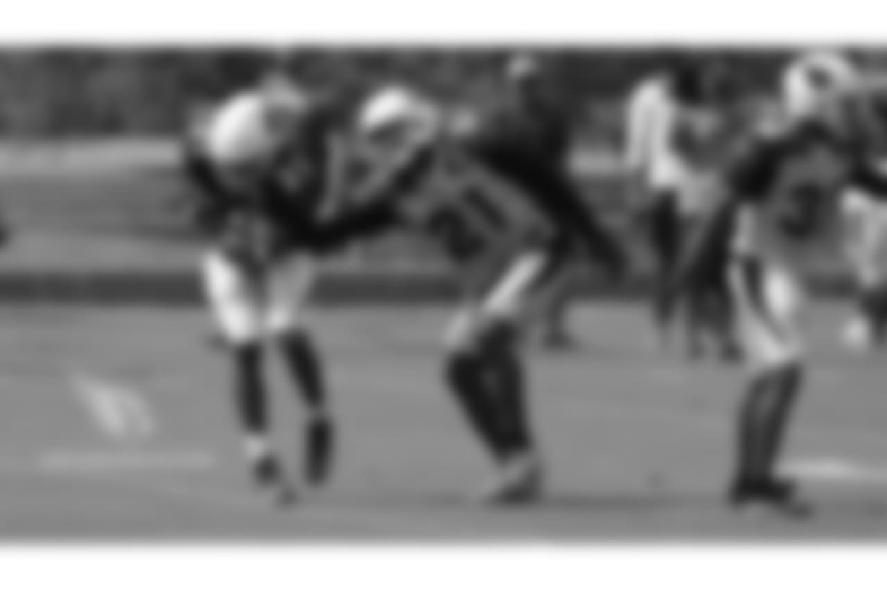 CB Patrick Peterson tries to strip RB David Johnson.