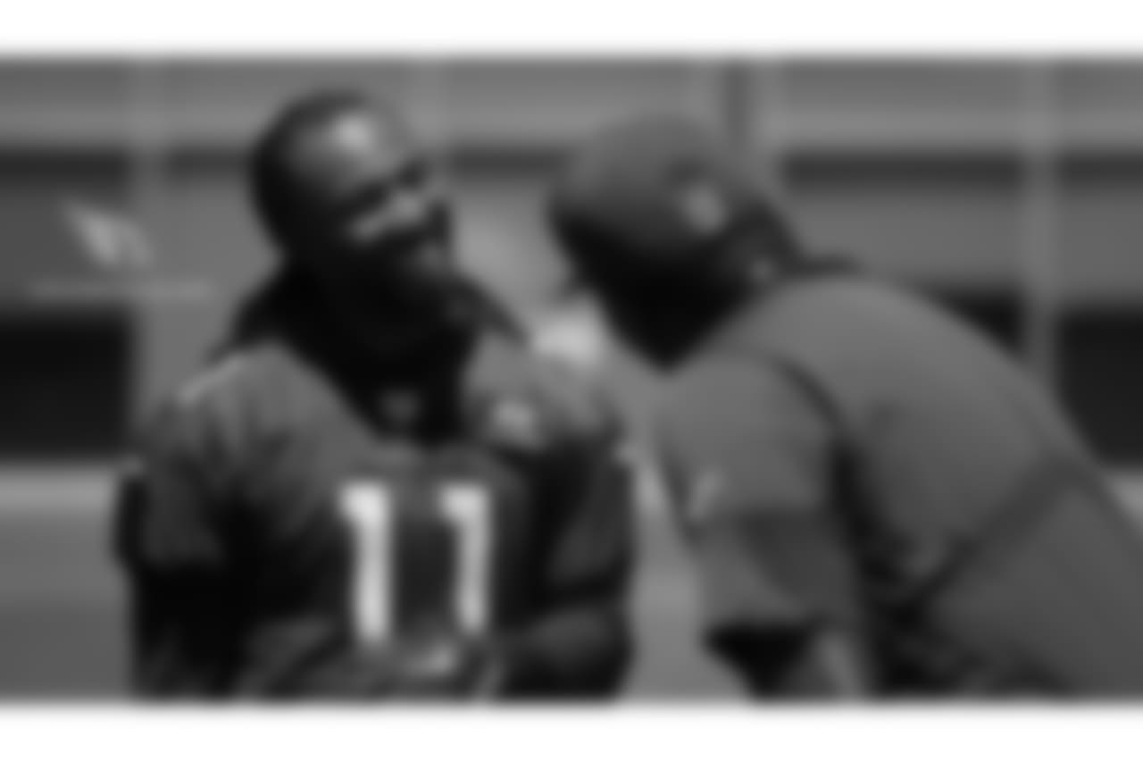 WR Larry Fitzgerald jokes with QB coach Byron Leftwich