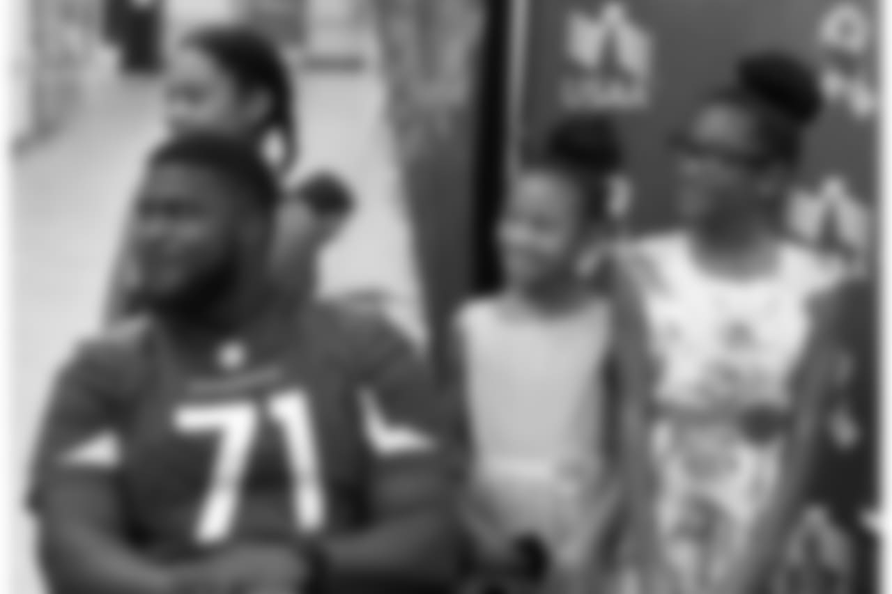 G Kaleb Johnson poses for photos with young fans