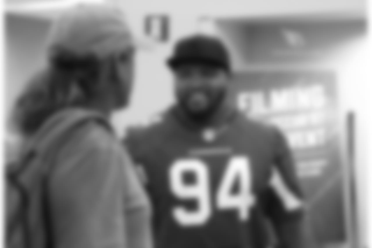 DT Xavier Williams talks with a fan