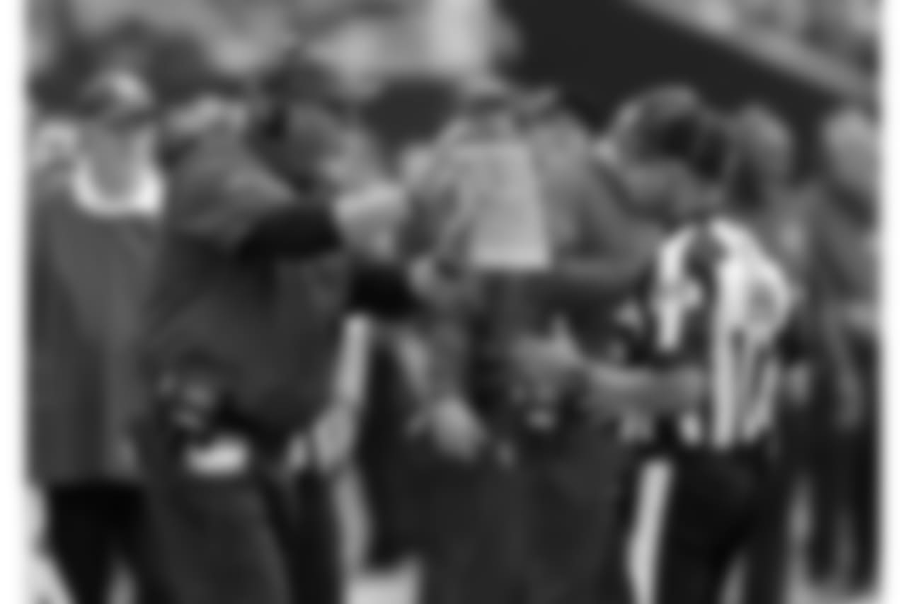 Head coach Bruce Arians pleads with the official