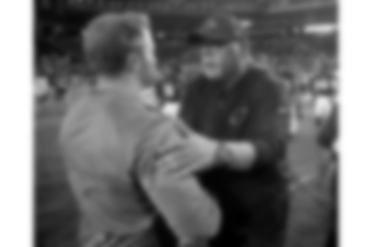 Cardinals head coach Bruce Arians (right) speaks with Rams head coach Sean McVay (left) after the game