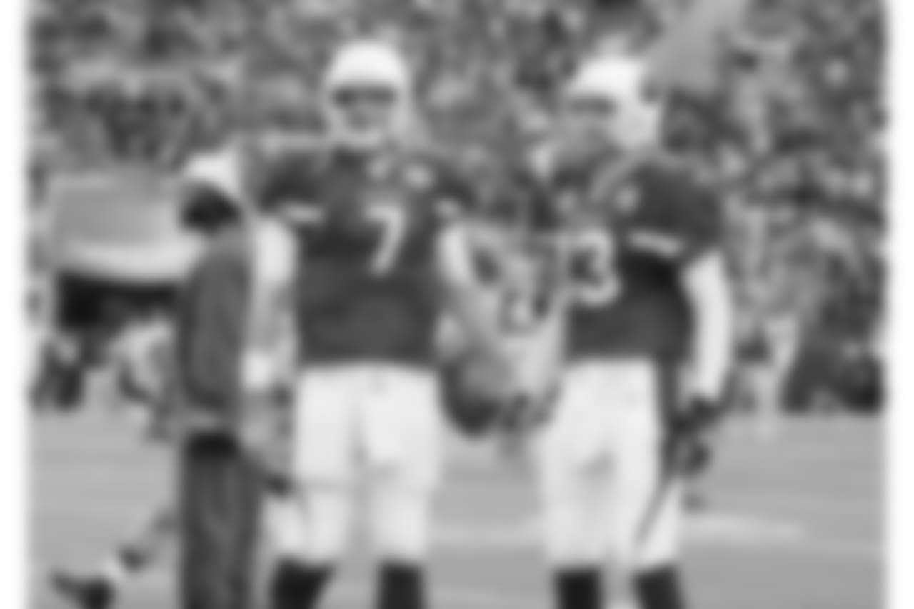 Warner (right) with QB Matt Leinart