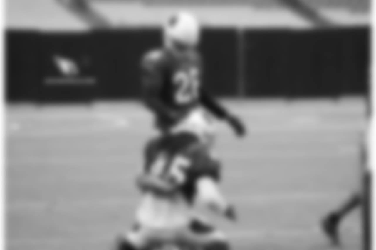 CB Justin Bethel pats LB Josh Bynes on the head