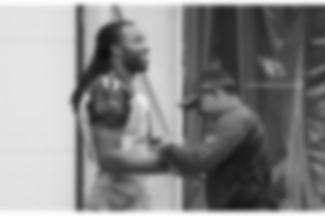 WR Larry Fitzgerald gets his hand taped by head athletic trainer Tom Reed