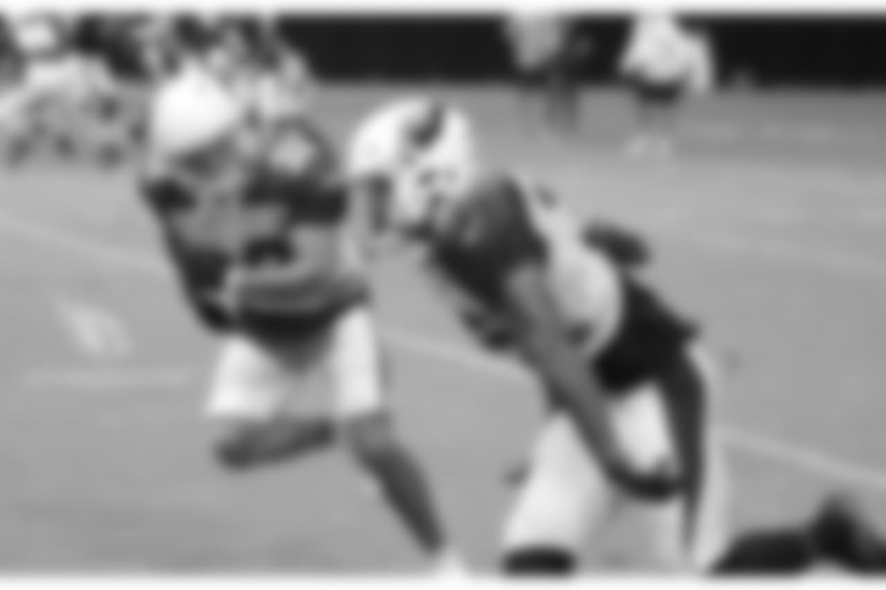S Tyrann Mathieu races with S Budda Baker