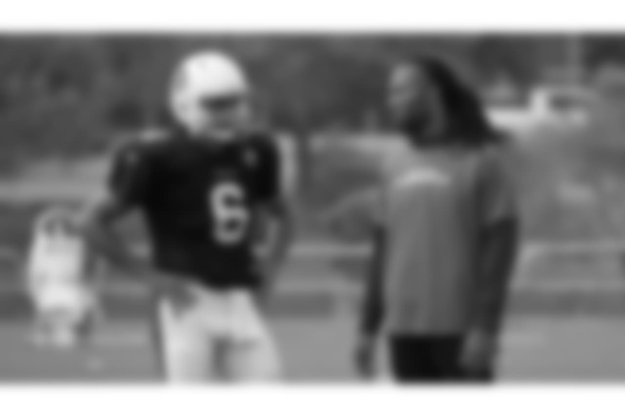 QB Charles Kanoff talks to WR Larry Fitzgerald.